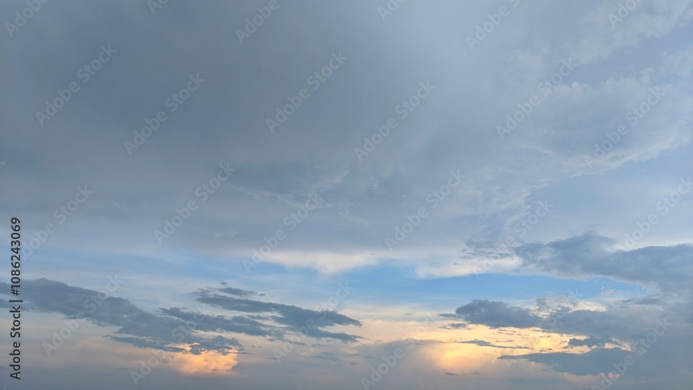 A dramatic sky with a mix of dark, stormy clouds and a vibrant sunset. The clouds create a sense of depth and movement, while the warm hues of the sunset provide a striking contrast. A dramatic sky with a mix of dark, stormy clouds and a vibrant sunset. The clouds create a sense of depth and movement, while the warm hues of the sunset provide a striking contrast.