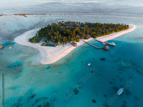 Fototapeta Naklejka Na Ścianę i Meble -  Aerial views of Velavaru Island at sunset in Maldives