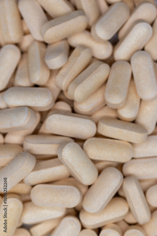 Close Up of a variety of yellow pharmaceutical pills, vitamins, antibiotics, capsules concept of pharmacy, health, medicine, business, pharmaceutical, background. selective focus. Close Up of a variety of yellow pharmaceutical pills, vitamins, antibiotics, capsules concept of pharmacy, health, medicine, business, pharmaceutical, background. selective focus.
