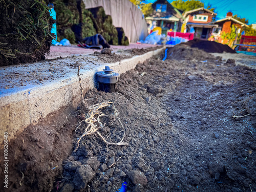 Placement of sprinklers and sprinkler pipes in newly planted lawns