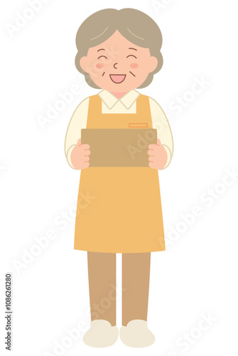 段ボールを運ぶエプロン姿のシニア女性