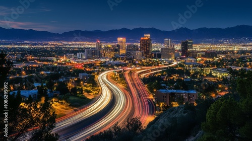 City skyline with highway and mountains at dusk.