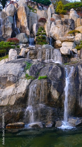 an artificial waterfall in a park