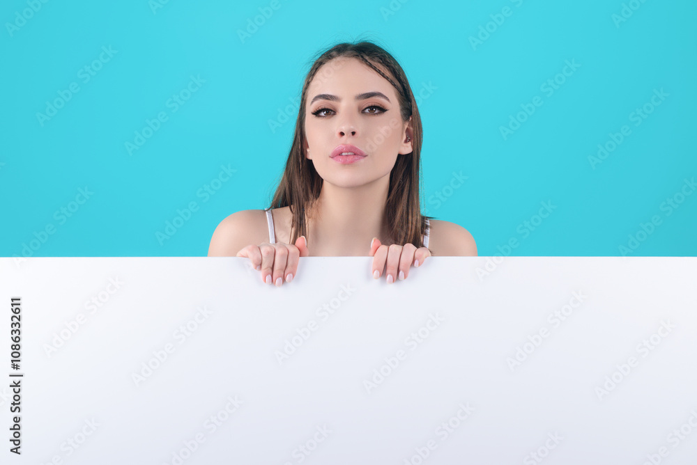 Portrait of woman holding a blank banner. Advertising banner sign. Woman hold empty blank billboard paper sign board. Board banner promo. Woman presenting something on blank board with empty space. Portrait of woman holding a blank banner. Advertising banner sign. Woman hold empty blank billboard paper sign board. Board banner promo. Woman presenting something on blank board with empty space.