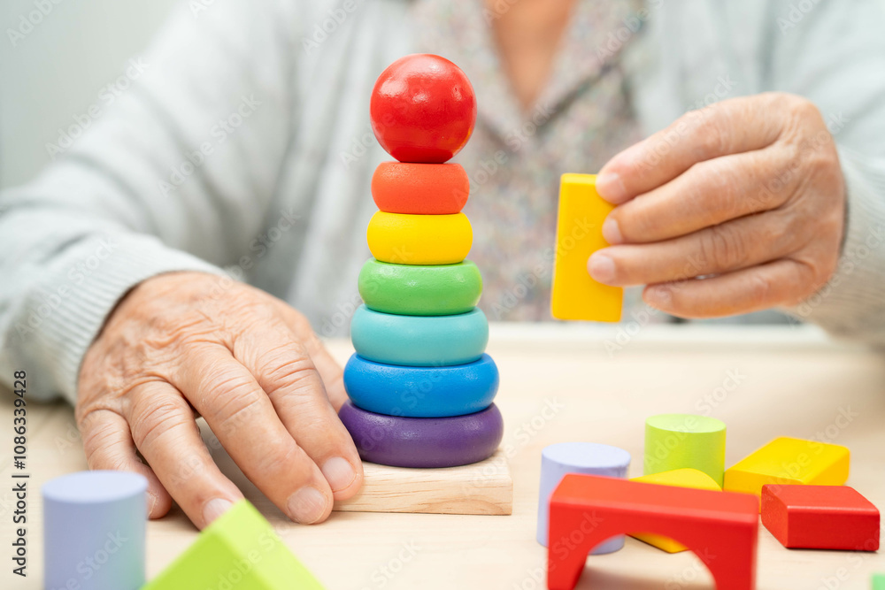 Asian elderly woman playing game. Asian elderly woman playing game.
