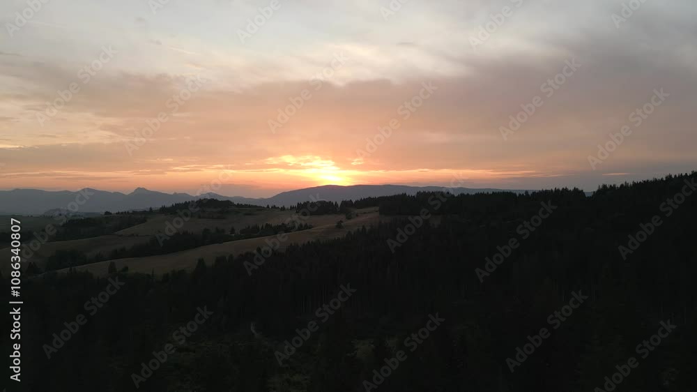 Aerial shot of Atmospheric summer sunset over Forest located in Europe Slovakia Aerial shot of Atmospheric summer sunset over Forest located in Europe Slovakia