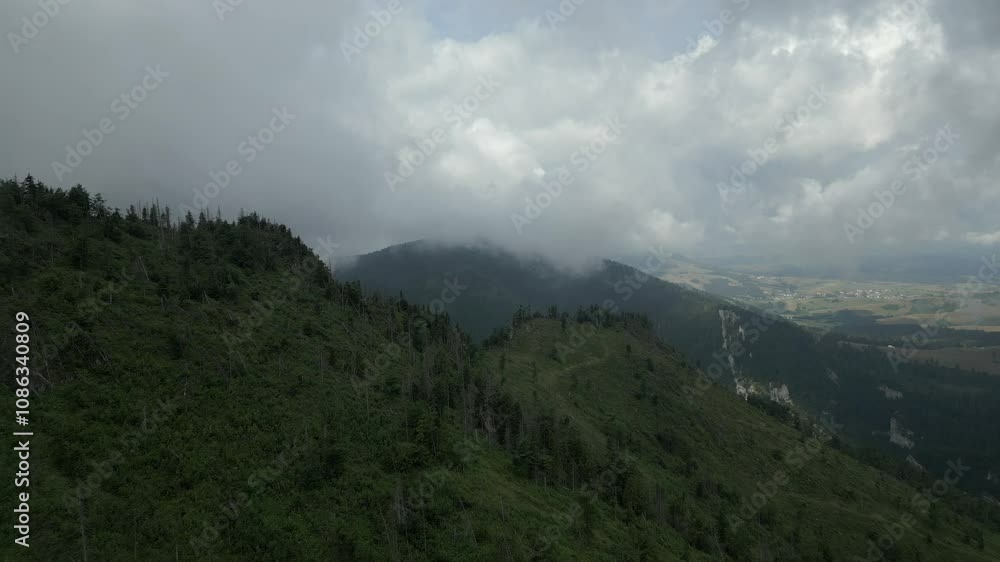 Drone Flyover fog revealing beautiful green mountains in Slovakia Drone Flyover fog revealing beautiful green mountains in Slovakia