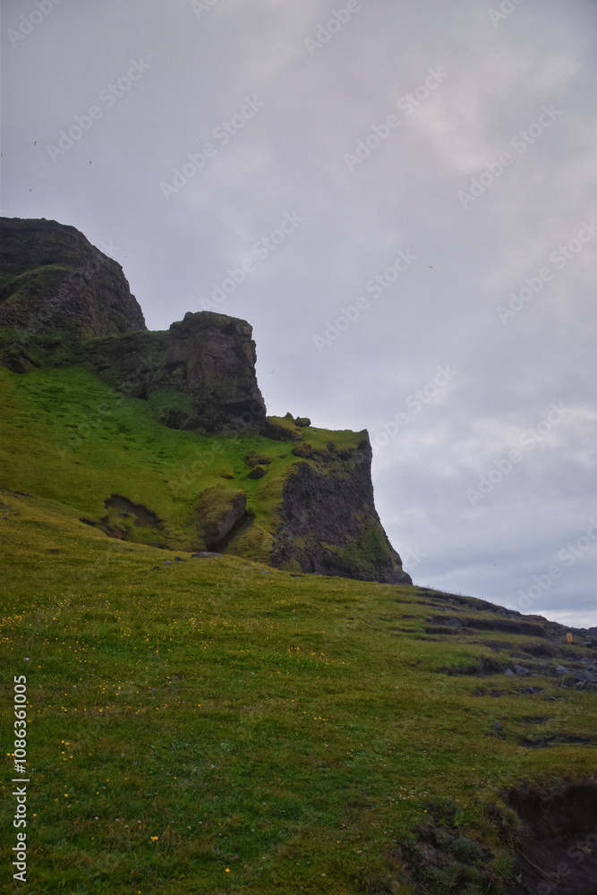 Reynisfjara black-sand beach found on the Ocean South Coast of Iceland, basalt columns and the dramatic Reynisdrangar sea stacks. Iceland, Europe. Reynisfjara black-sand beach found on the Ocean South Coast of Iceland, basalt columns and the dramatic Reynisdrangar sea stacks. Iceland, Europe.