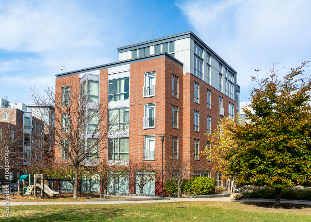 Multi-story brick apartment complex with green space and playground in Brighton, Massachusetts, USA
Multi-story brick apartment complex with green space and playground in Brighton, Massachusetts, USA
