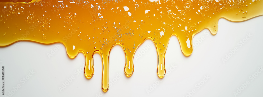 Honey dripping on white background