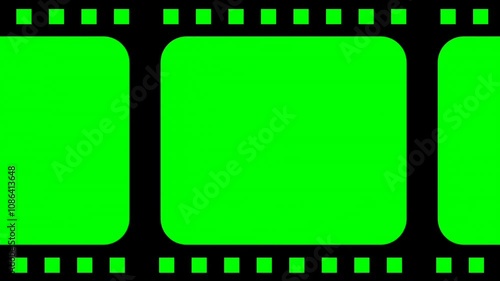 Scrolling Green screen loop footage of old negative film strip frame.