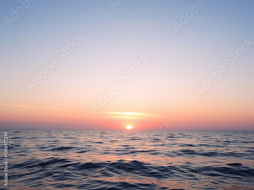 Softly glowing pastel pink sunset on a peaceful ocean, gentle hues, serene, serenity photo