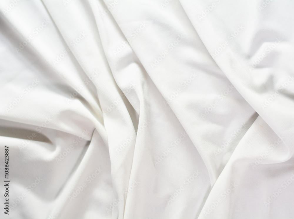 folds of white cloth that form various random patterns to become curved and straight images plus thin and thick shadows folds of white cloth that form various random patterns to become curved and straight images plus thin and thick shadows