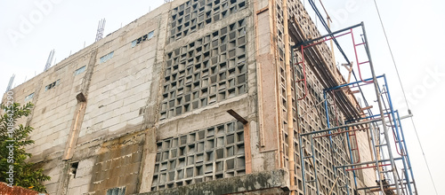 building under construction with scaffolding