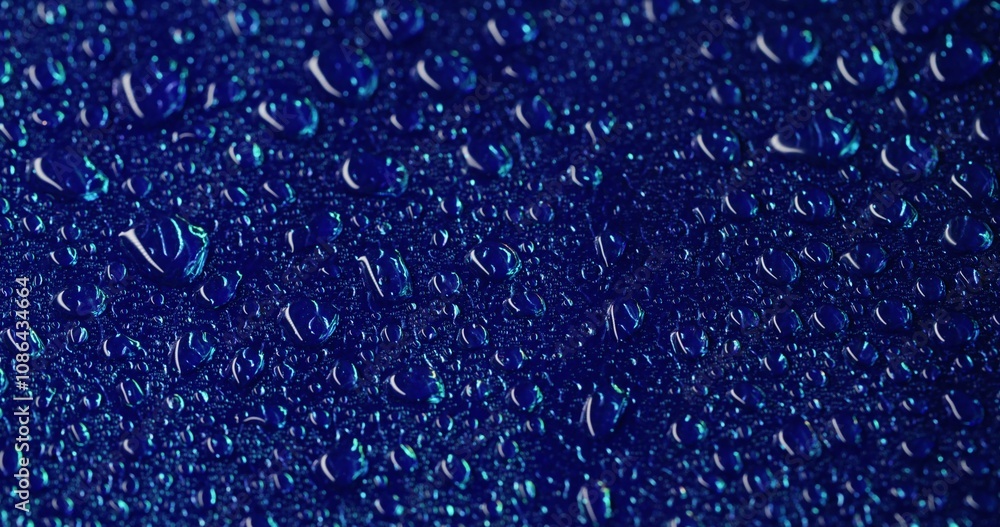 Humidity surface. Drop stream. Transparent dew on smooth blue area. Watery dark background with overlay reflections on wet texture. Humidity surface. Drop stream. Transparent dew on smooth blue area. Watery dark background with overlay reflections on wet texture.