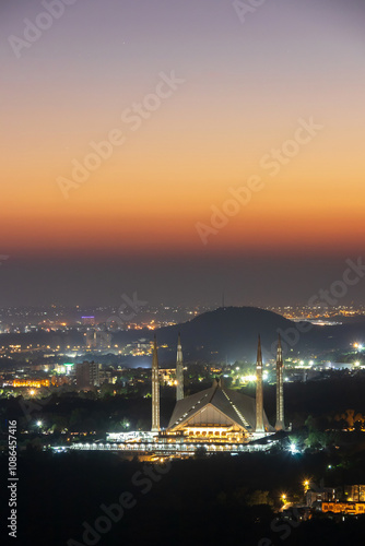 The Faisal Mosque is the national mosque of Pakistan, located in the capital city, Islamabad. It is the fifth-largest mosque in the world. photo