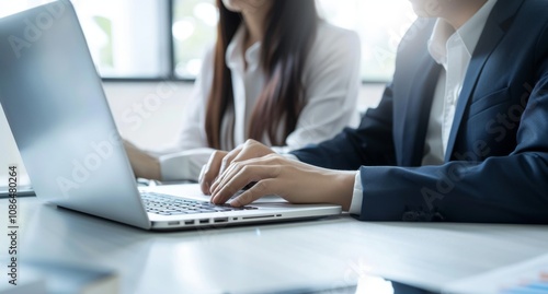 Asian Business Colleagues Collaborating in a Modern Office Setting