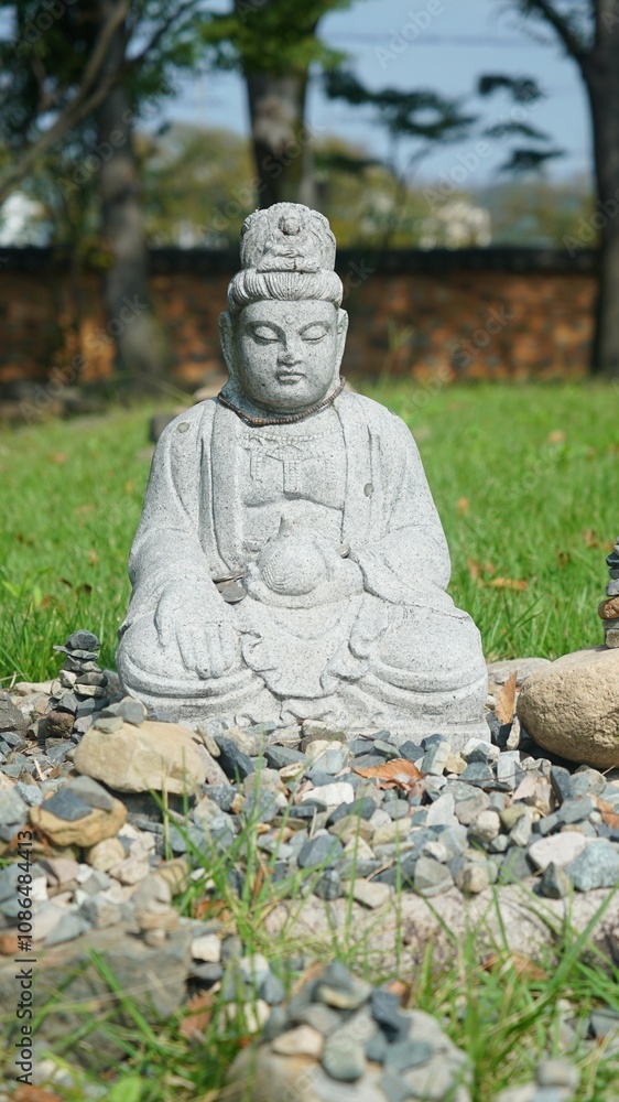 a small Buddhist statue in a Buddhist temple a small Buddhist statue in a Buddhist temple