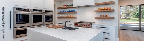 Modern luxury kitchen with sleek built-in appliances, open shelves styled with colorful glassware, a marble island, warm wooden floors, bright yet balanced lighting