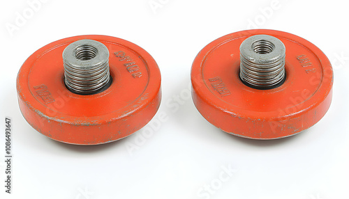 Pair of vintage orange weight plates with threaded inserts, ideal for fitness, gym, or retro-themed projects. photo