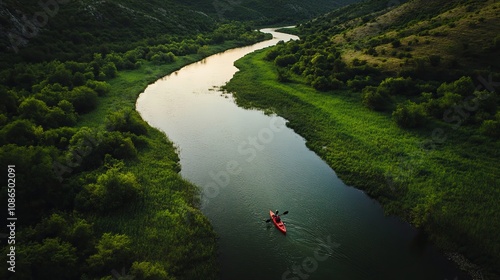 Kayak adventure on winding river with lush greenery and hills