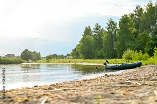 Beautiful evening atmosphere at sunset on the beach of Lake Razna, Raznas ezers, the largest lake in Latvia with panorama over the water, beach and forest in the background, Latgale, Latvia photo