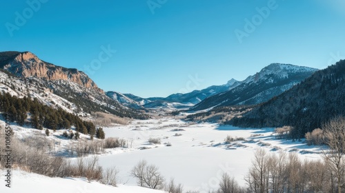 Majestic Winter Mountain Valley Landscape SnowCovered Peaks, Frozen River, Blue Sky