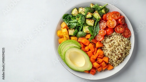 Closeup of a plate with roasted vegetables, quinoa, and avocado, symbolizing a balanced carbfocused diet, balanced plate, healthy carbs