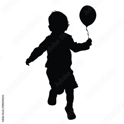 A boy is running with a balloon. The balloon is black and white. The boy is wearing shorts