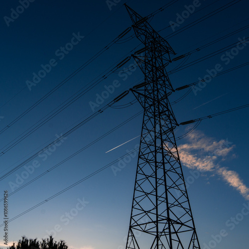 Light towers and high voltage cables photo