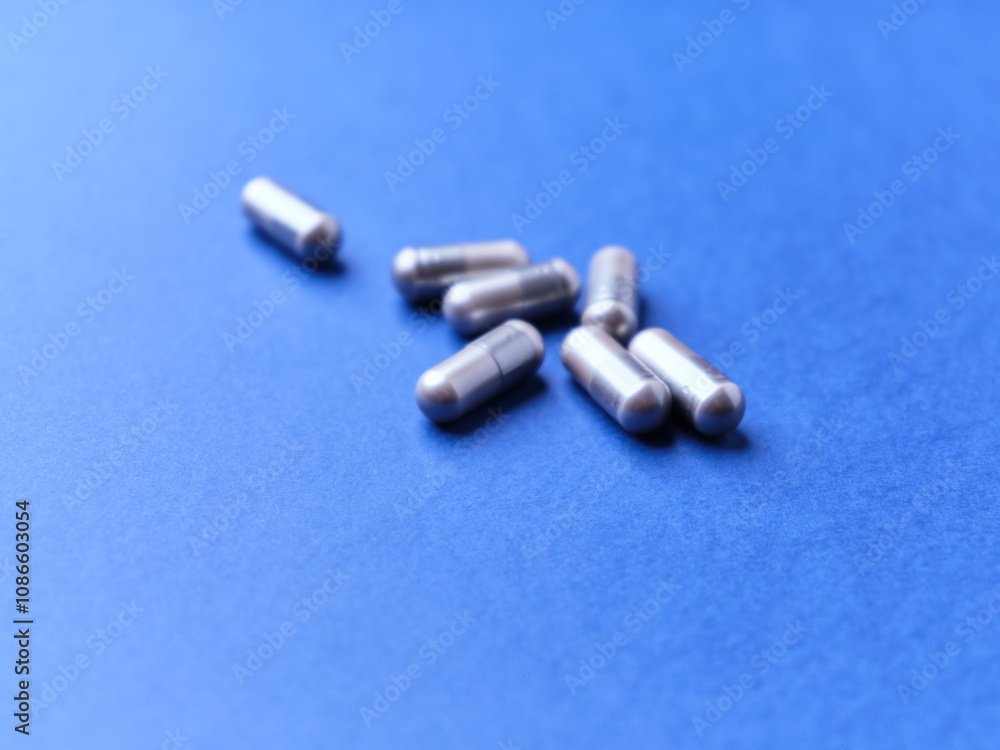 BCAA amino acids capsules. Nutrition for bodybuilding. Fitness supplements on paper background. Soft focus. Copy space BCAA amino acids capsules. Nutrition for bodybuilding. Fitness supplements on paper background. Soft focus. Copy space
