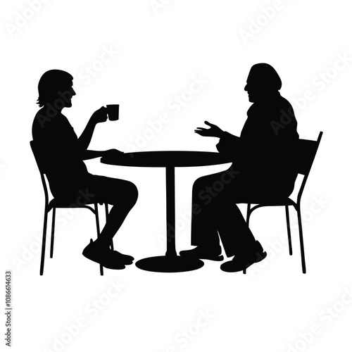 Two men sitting at a table. One man is drinking coffee. The other man is talking. There are two chairs