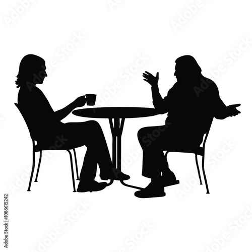 Two people sitting at a table. One of them is holding a cup. The table is round