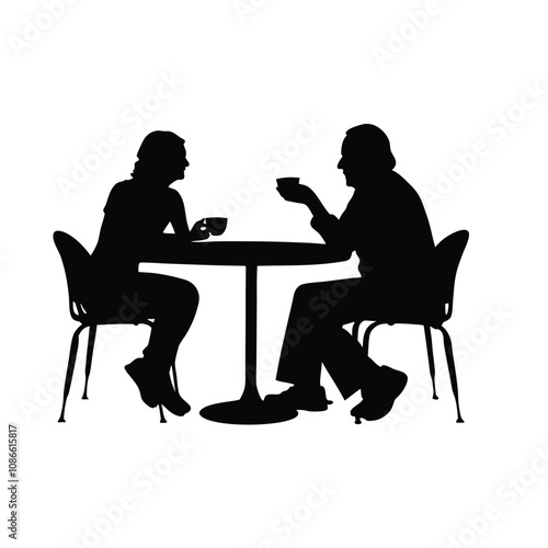Two people sitting at a table. One of them is holding a cup. The table is round