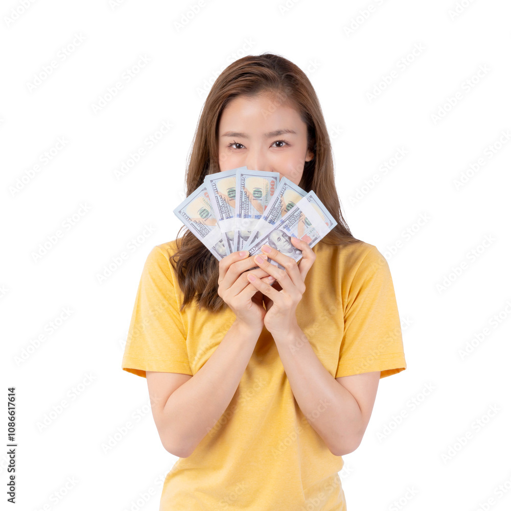 Successful beautiful Asian business young woman wearing a yellow t shirt holding money US dollar bills in hand isolated on a transparent png background with copy space , business concept Successful beautiful Asian business young woman wearing a yellow t shirt holding money US dollar bills in hand isolated on a transparent png background with copy space , business concept