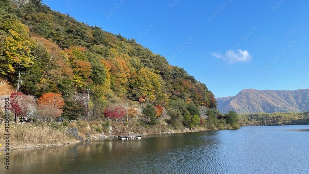 Fototapeta premium The trees leaves on the mountains were starting to change color.