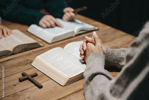 Christians are congregants join hands to pray and seek the blessings of God. photo