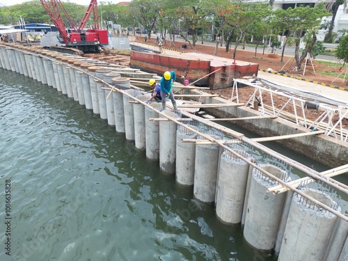 construction and landscaping projects A giant sea wall to proteck Jakarta from sea flood photo