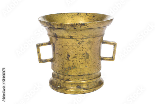 The image shows a metal vessel made of a material resembling brass or bronze. The vessel is cylindrical in shape, widening towards the top edge, and decorated with two rectangular handles on the sides photo