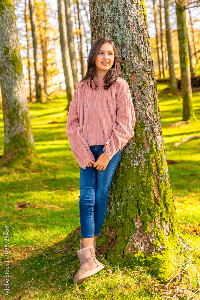 Portrait of a cute teen girl leaning on tree trunk Portrait of a cute teen girl leaning on tree trunk