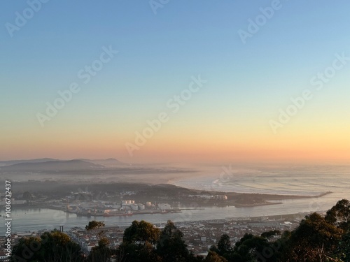 Sunset over the Atlantic Ocean and the city Viana do Castelo viewed from the top of Santa Luzia mountain, Portugal, January 2024