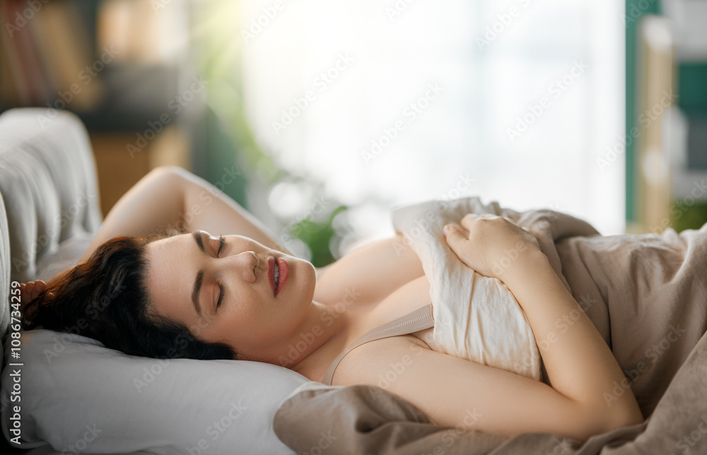 Obraz premium woman is sleeping in the bedroom