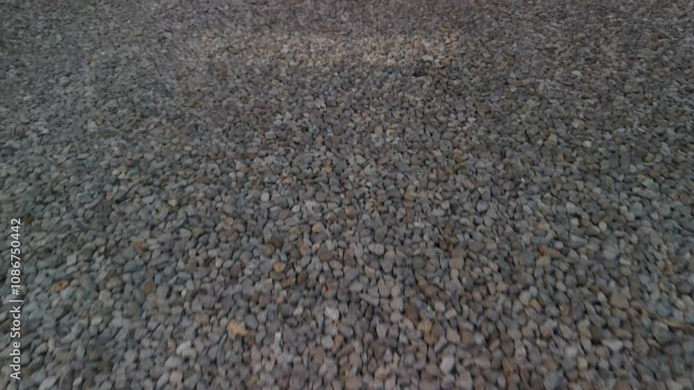 Dynamic video of gravel texture in motion, perfect for natural or design backgrounds Dynamic video of gravel texture in motion, perfect for natural or design backgrounds
