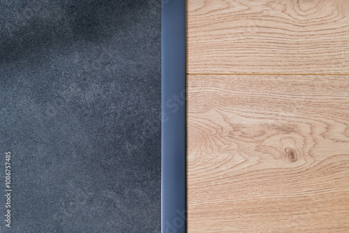 Obraz na płótnie Anthracite expansion strip between ceramic tiles and floor panels. Aesthetic floor finishing. finishing strip. Interior w salonie