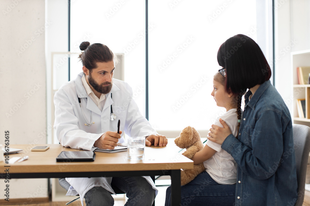 Caucasian male doctor examines young girl coughing in clinic while mother watches. Doctor writes down prescription, ensuring detailed care. Scene reflects healthcare and family wellbeing atmosphere. Caucasian male doctor examines young girl coughing in clinic while mother watches. Doctor writes down prescription, ensuring detailed care. Scene reflects healthcare and family wellbeing atmosphere.