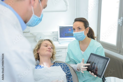 woman dentist working at her patients teeth