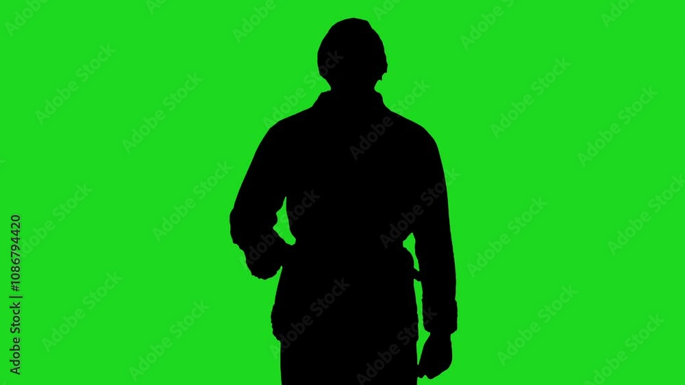 silhouette of a man standing and talking action against a bright green background silhouette of a man standing and talking action against a bright green background