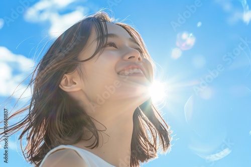 Beautiful Japanese woman on a sunny day with a vibrant blue sky