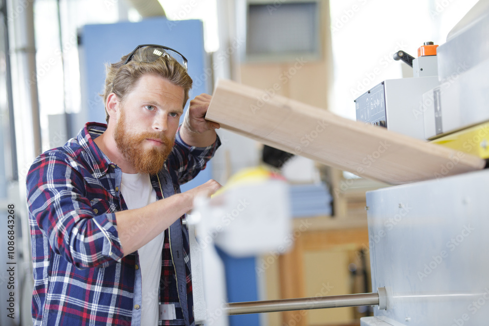 carpenter working in woodworking workshop carpenter working in woodworking workshop