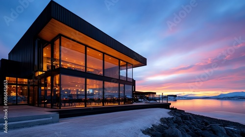 A modern glass dome lodge with a panoramic view of the Northern Lights